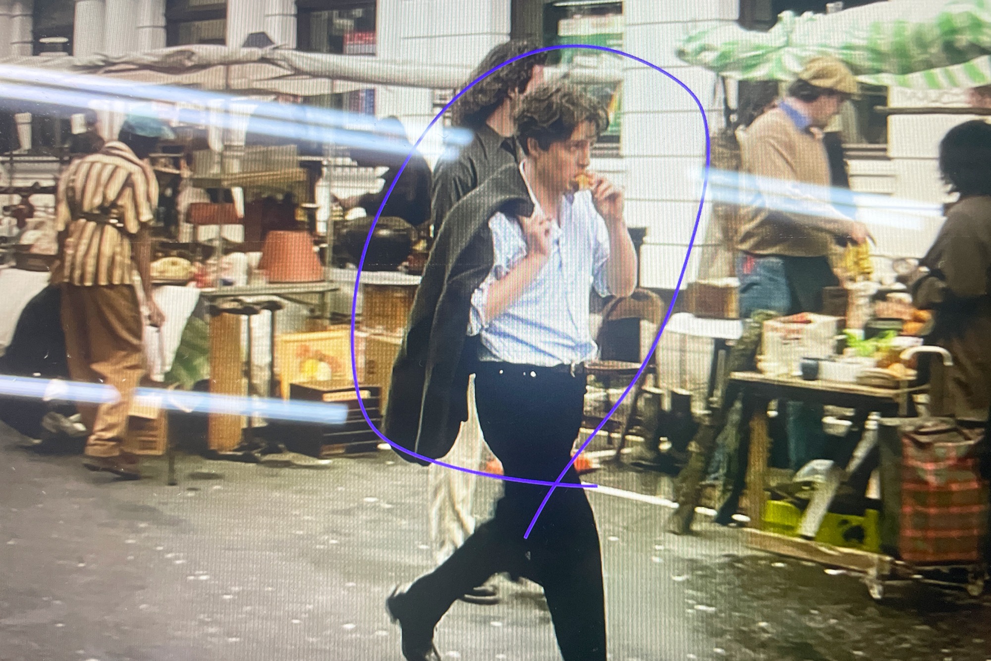 A fashion image with a person circled by hand